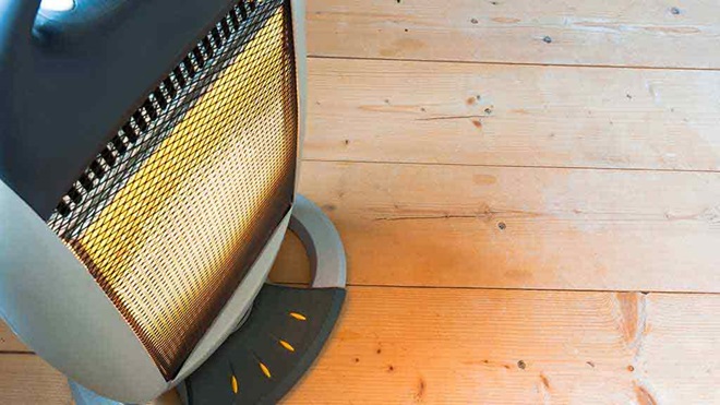 electric heater on wooden floor